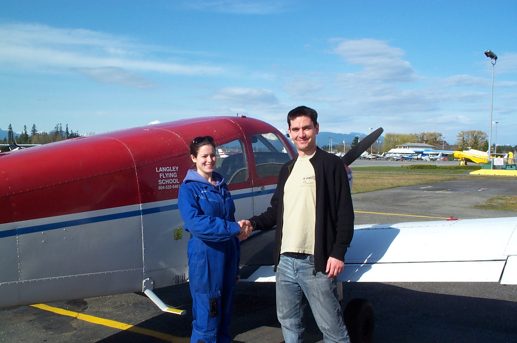 Jonathan King with Flight Instructor Naomi Jones after the successful completion of Jonathan's Private Pilot Flight Test on April 11, 2010.  Langley Flying School.